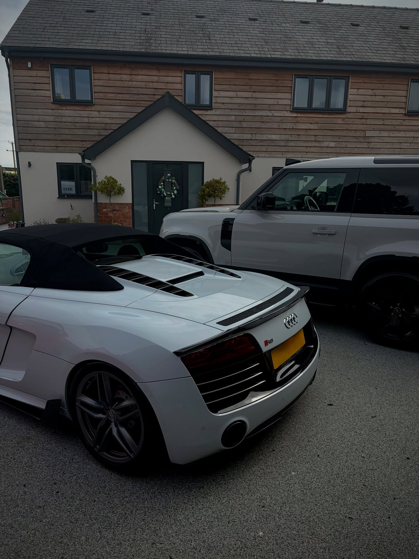 White Audi R8 and Land Rover Defender in Herefordshire