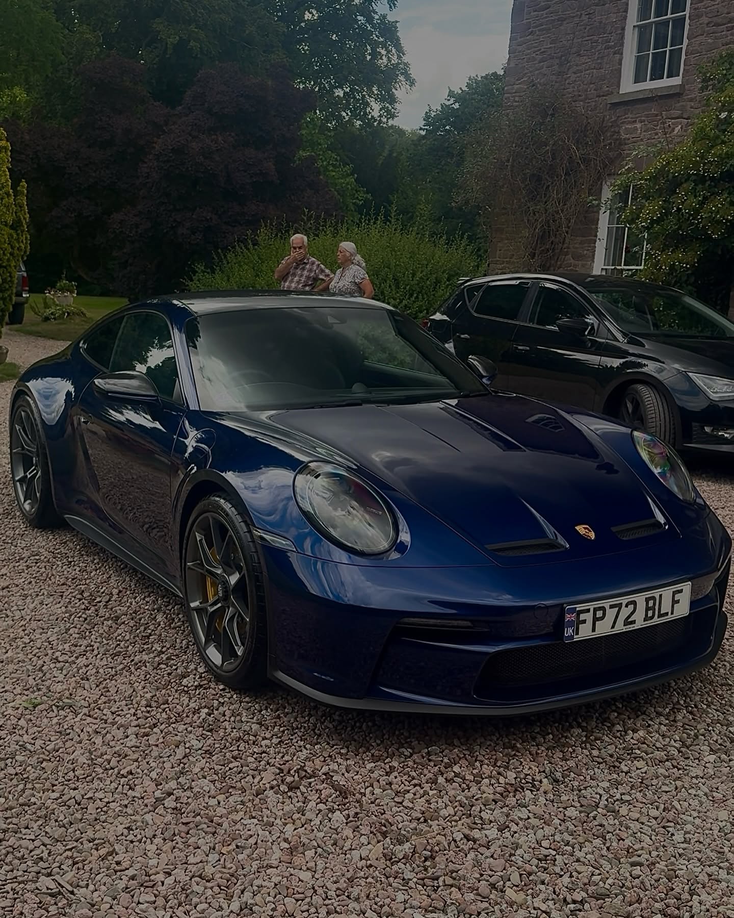 Blue Porsche with reflective paintwork