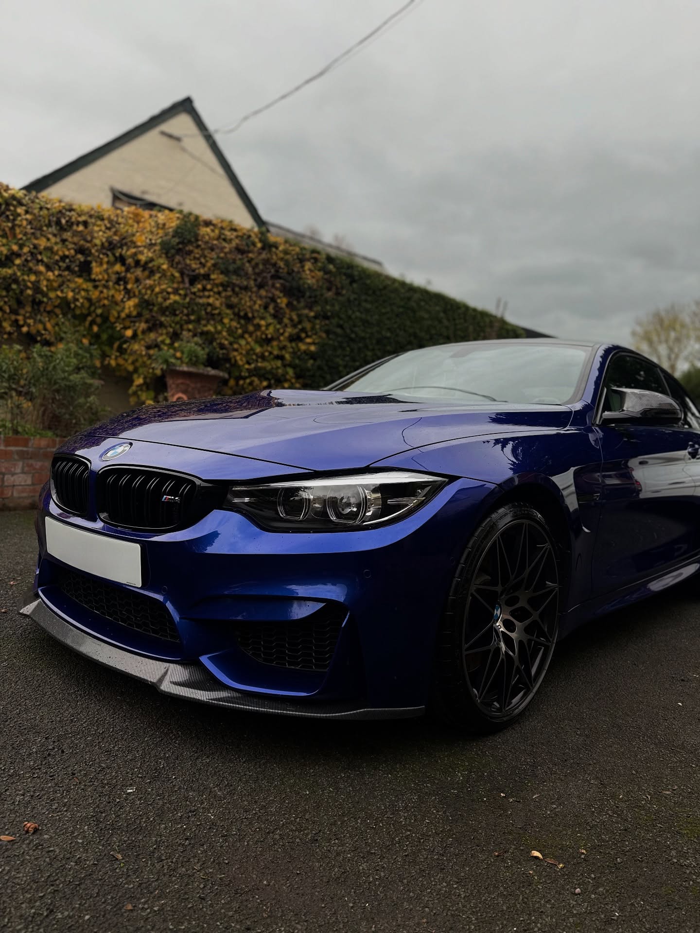 Blue BMW coupe with reflective paintwork