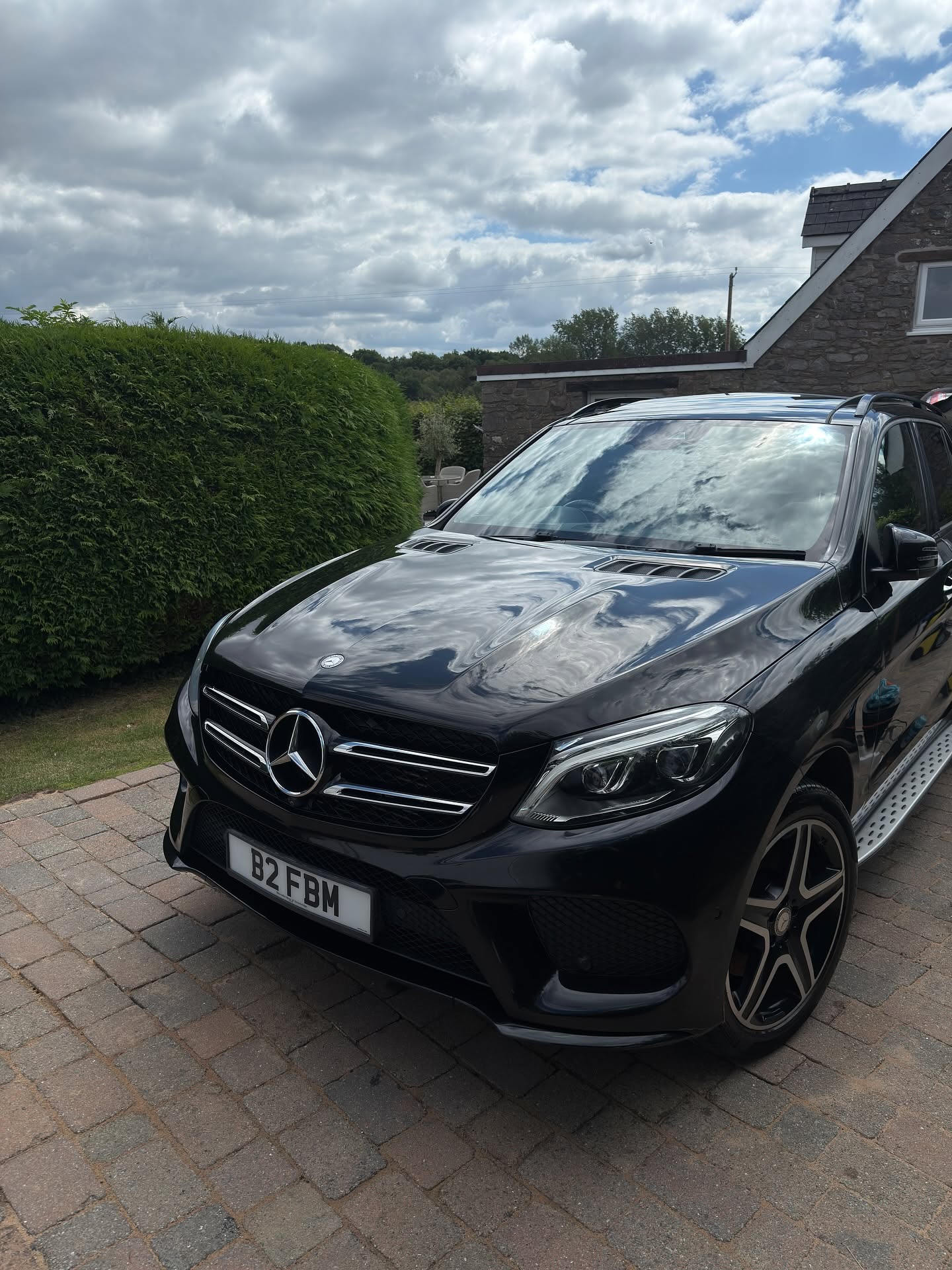 Black Mercedes with clean, reflective paint