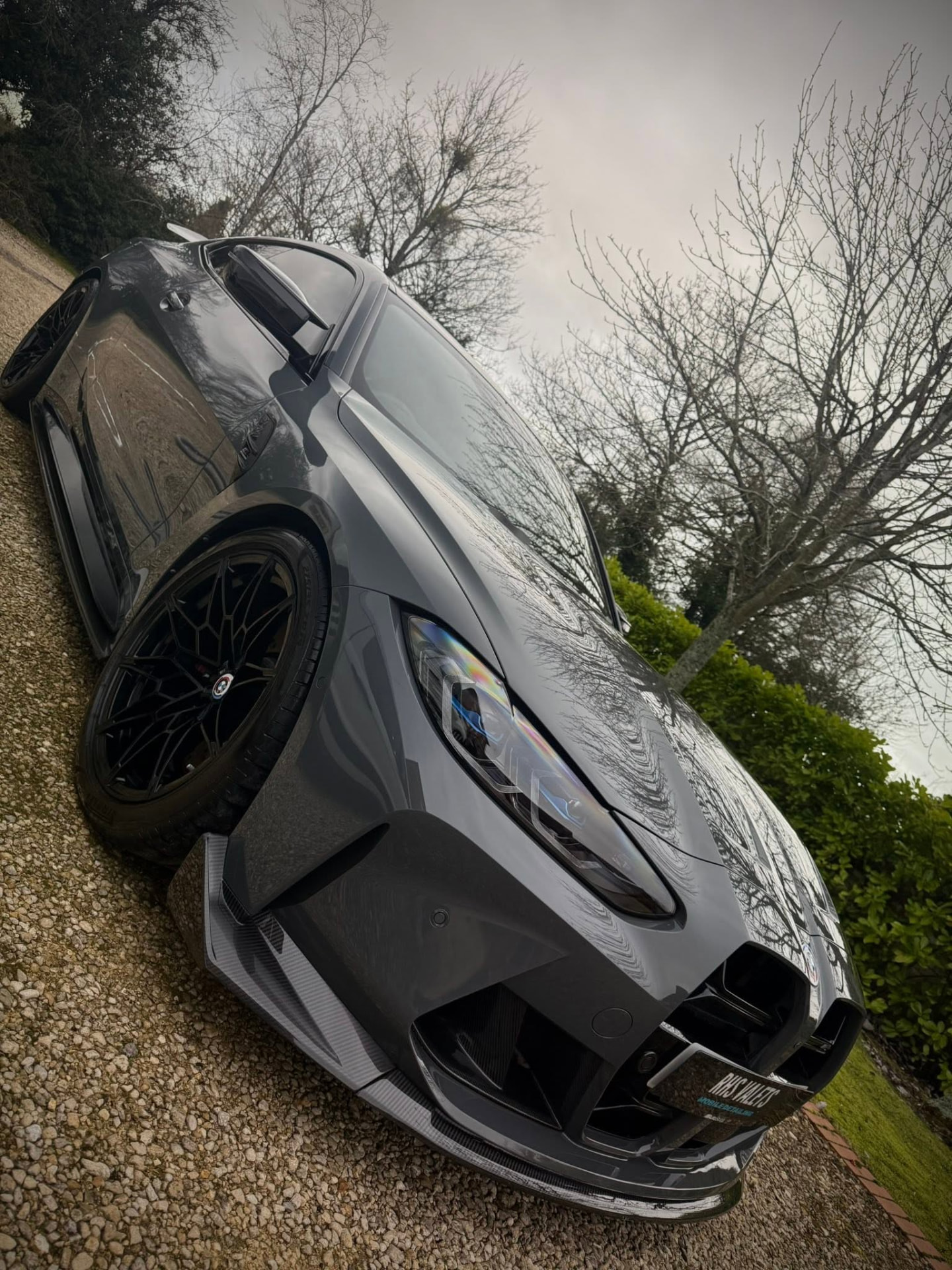 Grey BMW photographed from a low angle